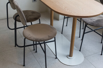 chairs and table in bright modern interior with white wall.