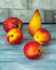 Fruit set of pears, apples and nekrarin on a blue wooden tray