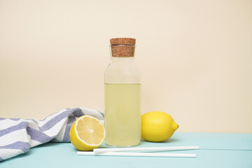 Lemonade or mojito cocktail with lemon and mint, cold refreshing drink or beverage with ice. Copy space for your text