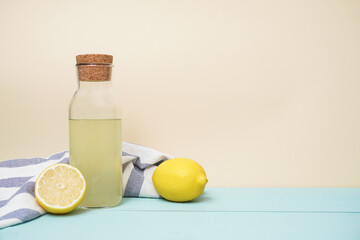 Lemonade or mojito cocktail with lemon and mint, cold refreshing drink or beverage with ice. Copy space for your text