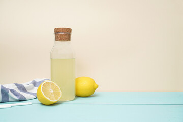 Lemonade or mojito cocktail with lemon and mint, cold refreshing drink or beverage with ice. Copy space for your text