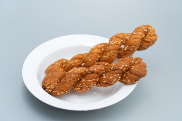 Mahua, a traditional food in old Beijing, China. Old Beijing Mahua. Chinese old Beijing traditional gourmet twist. Old Beijing fried pasta dessert.