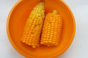 corn or maize in orange bowl