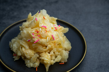 Chinese traditional Beijing snack with pastry fried with ginger juice and sugar. Old Beijing ginger sauce fork. Old Beijing snack fork. 