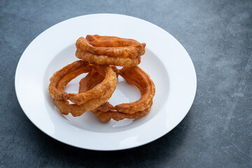 Traditional food jiaoquan in old Beijing of China. Old Beijing specialty food jiaoquan. Fried doughnut, a traditional snack in Beijing.