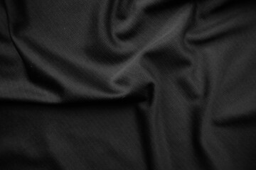 Background texture black cloth. Abstract dark wavy soft. Fabric is wrinkled. Fashion luxury style.