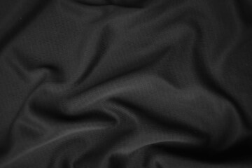 Background texture black cloth. Abstract dark wavy soft. Fabric is wrinkled. Fashion luxury style.