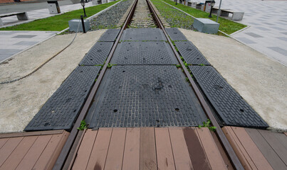Rubber coating on a railway crossing.