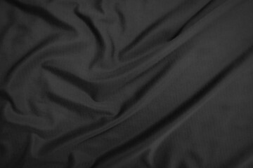 Background texture black cloth. Abstract dark wavy soft. Fabric is wrinkled. Fashion luxury style.