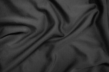Fototapeta premium Background texture black cloth. Abstract dark wavy soft. Fabric is wrinkled. Fashion luxury style.