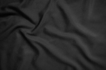 Background texture black cloth. Abstract dark wavy soft. Fabric is wrinkled. Fashion luxury style.