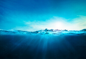 blue ocean underwater , deep ocean, blue water waves with sun beam clear view realistic, world...
