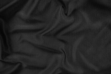 Background texture black cloth. Abstract dark wavy soft. Fabric is wrinkled. Fashion luxury style.