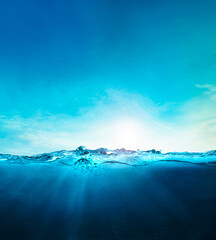 blue ocean underwater , deep ocean, blue water waves with sun beam clear view realistic, world...