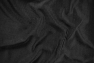 Background texture black cloth. Abstract dark wavy soft. Fabric is wrinkled. Fashion luxury style.