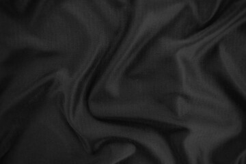 Fototapeta premium Background texture black cloth. Abstract dark wavy soft. Fabric is wrinkled. Fashion luxury style.