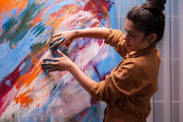 Fotobehang Schilderij Creative hand painting in art workshop on large canvas. Modern artwork paint on canvas, creative, contemporary and successful fine art artist drawing masterpiece  © DC Studio