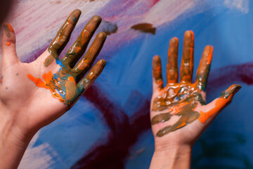 Close up of artist hands with paint in art studio. Modern artwork paint on canvas, creative,...
