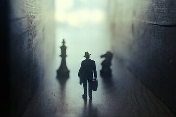 Businessman walks on an unknown road and chess at the end