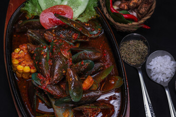 A Clam Dish With Padang Sauce