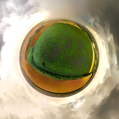 fields near the Kirpili river not far from the Nizhny farm (Krasnodar Territory. South of Russia) on a rainy summer day - a small planet panormama drone view