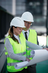 Man and woman discussing work. Colleagues working on project.	