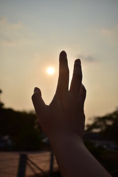 hands at sunset