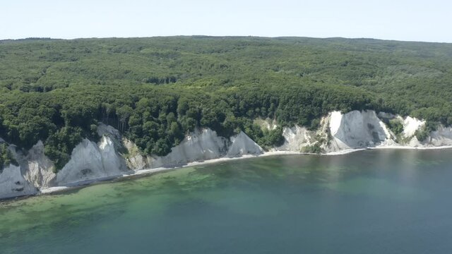 Drone Aerial Shot of the chalk cliffs on Ruegen R&uuml;gen in Germany in beautiful light with green and blue seawater, Europe