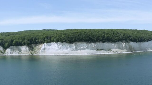 Drone Aerial Shot of the chalk cliffs on Ruegen R&uuml;gen in Germany in beautiful light with green and blue seawater, Europe