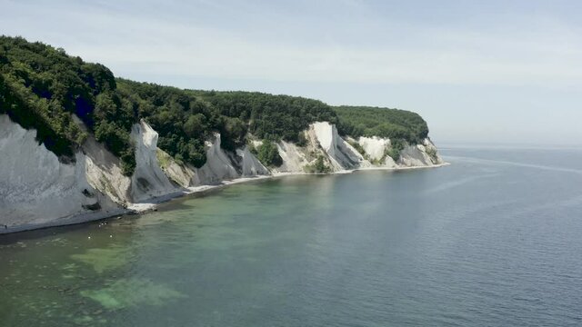 Drone Aerial Shot of the chalk cliffs on Ruegen R&uuml;gen in Germany in beautiful light with green and blue seawater, Europe