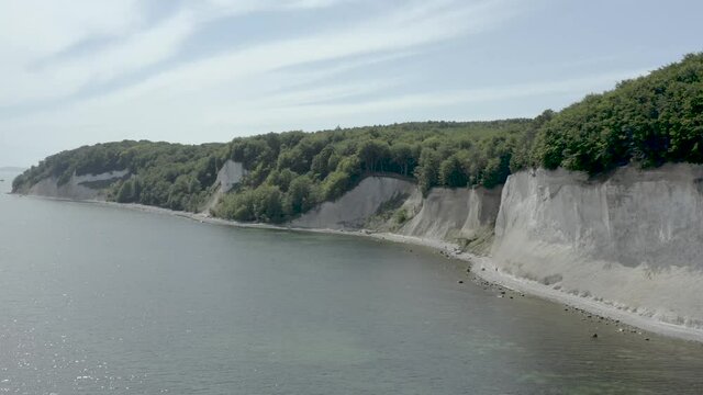 Drone Aerial Shot of the chalk cliffs on Ruegen R&uuml;gen in Germany in beautiful light with green and blue seawater, Europe