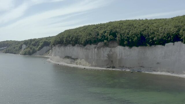 Drone Aerial Shot of the chalk cliffs on Ruegen R&uuml;gen in Germany in beautiful light with green and blue seawater, Europe