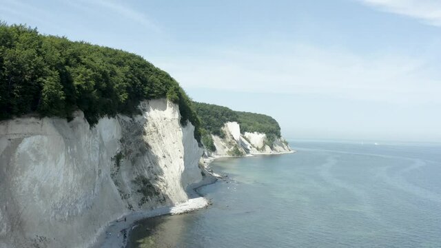 Drone Aerial Shot of the chalk cliffs on Ruegen R&uuml;gen in Germany in beautiful light with green and blue seawater, Europe