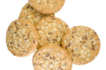 Cereal cookies with seeds and nuts close up isolated on a white background. Healthy food, gluten free diet