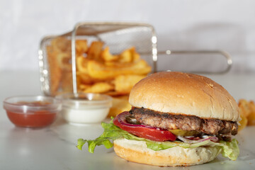 Still life with fast food hamburger menu, french fries and ketchup.Junk food. Fast carbohydrates not good for health