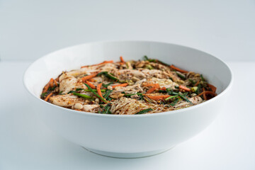 Close up traditional Korean dish kimchi in a white plate on a white background