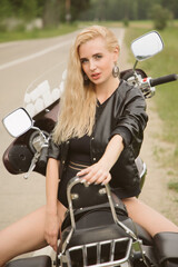 Blonde girl on a motorcycle