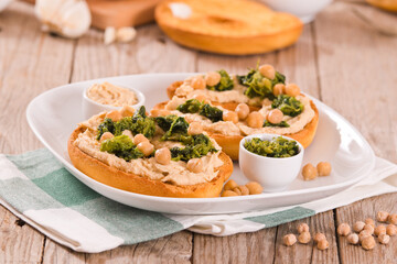 Friselle with turnip tops and hummus.
