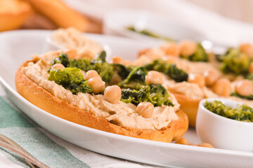 Friselle with turnip tops and hummus.
