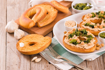 Friselle with turnip tops and hummus.
