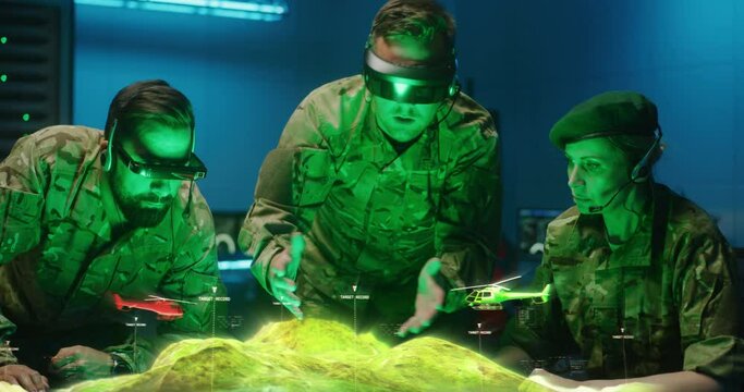 Soldiers discussing holographic landscape display