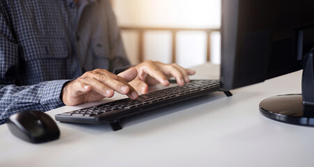 Motion blurred of hand. businessman typing on computer keyboard while he working on desk