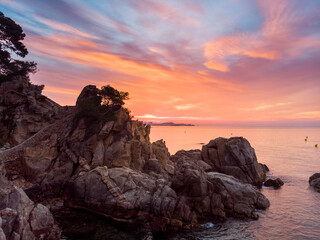 Аerial view. Rocks on the coast of Lloret de Mar in a beautiful summer day,sandy beach, Costa...