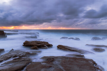 Naklejka premium Stormy morning sky over the coastline.