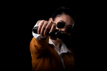 Portrait beautiful Asia woman with a pistol gun aimed at the front