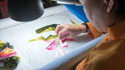 Embroideress is working on vietnamese traditional hand embroidery picture