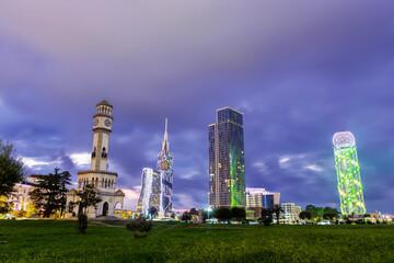 Beautiful Batumi, Georgian resort city and port at Black Sea panoramic view of city centre from sea in golden summer morning sunlight