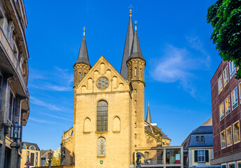 Bonn Minster or Bonner Munster Roman Catholic church Romanesque architecture building in historical city centre, blue sky background, North Rhine-Westphalia region, Germany