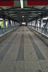 Architecture construction of elevator, escalator stairs and sky walk way, walk bridge between sky train station and department store mall