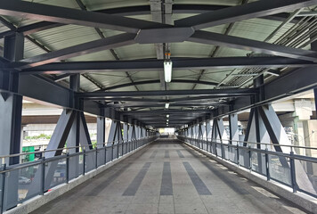 Architecture construction of elevator, escalator stairs and sky walk way, walk bridge between sky train station and department store mall